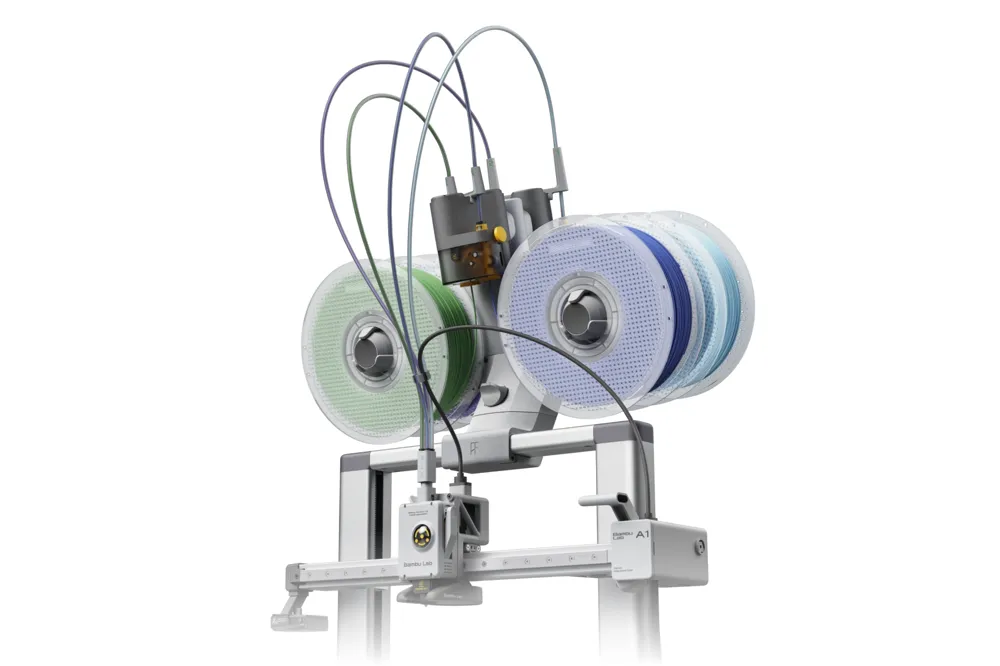 AMS Lite carrying four filament spools mounted directly above a Bambu Lab A1 on a 3D-printed top mount
