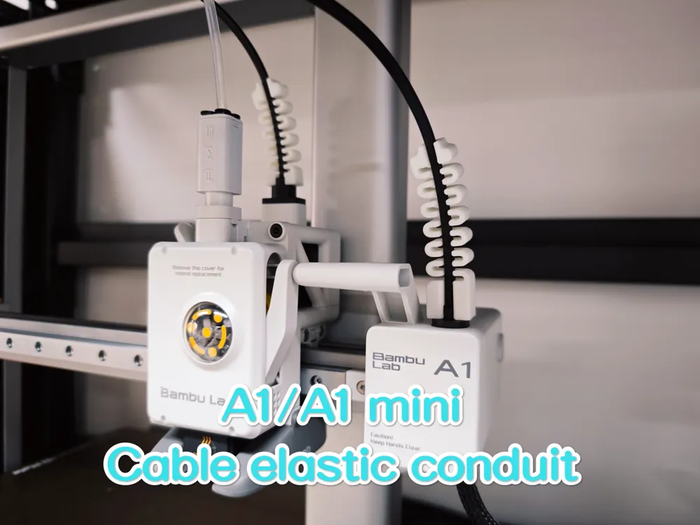 White 3D-printed spiral conduit wrapped around the toolhead cable of a Bambu Lab A1