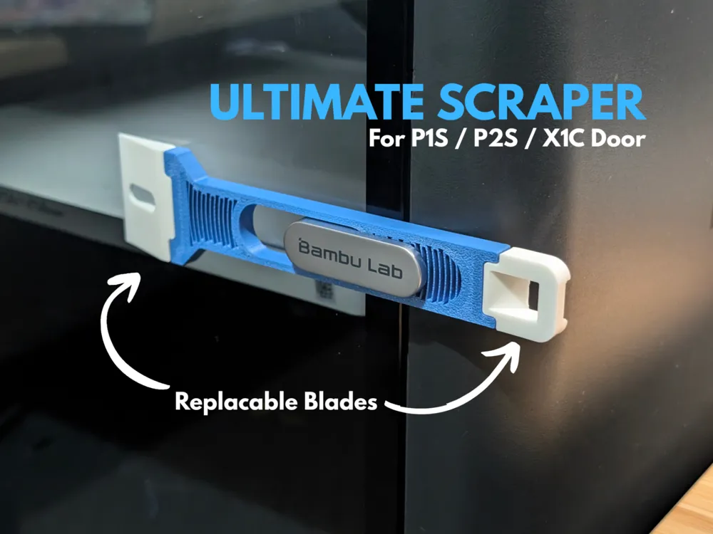 Blue 3D-printed scraper with replaceable blades clipped onto a printer door